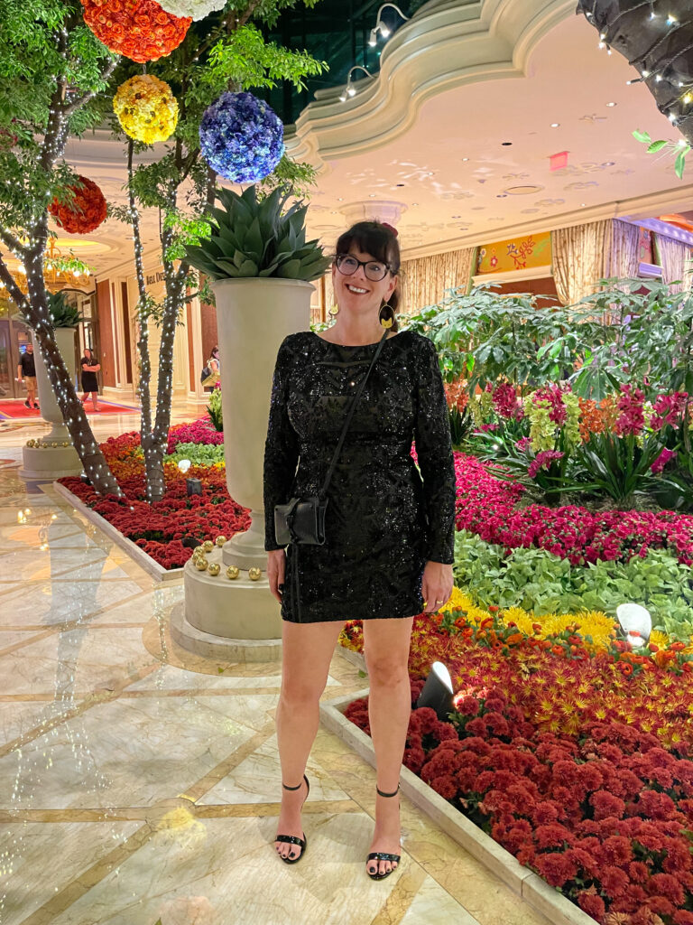 Rachelle in sequins in an indoor garden, vegas style