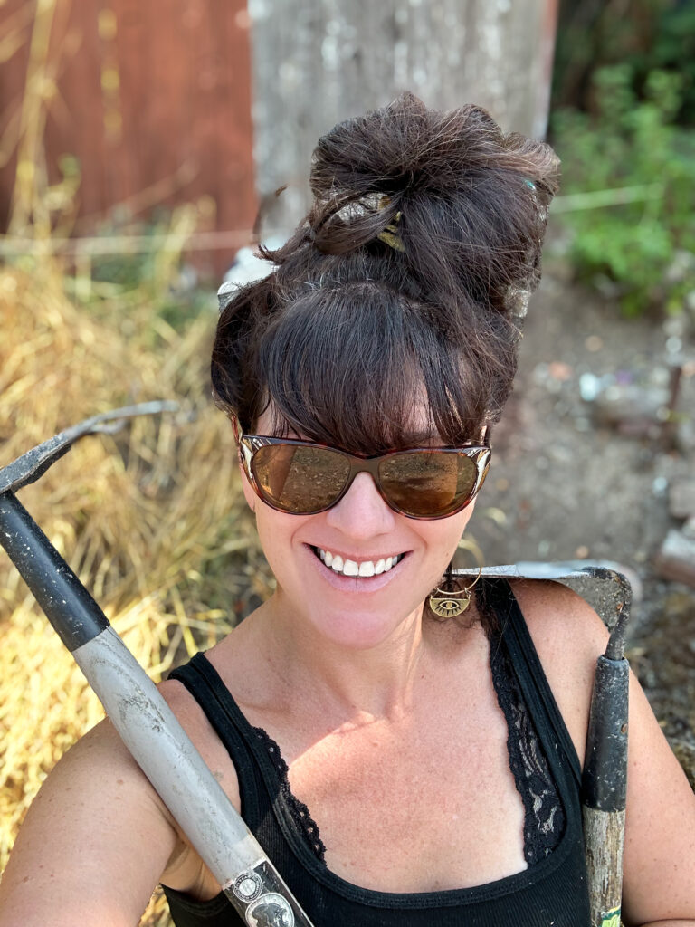 Rachelle getting dirty with some serious garden tools